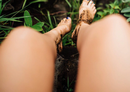 Running barefoot on a nature trail