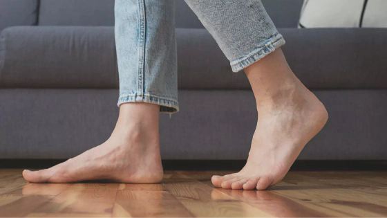 Person walking barefoot at home